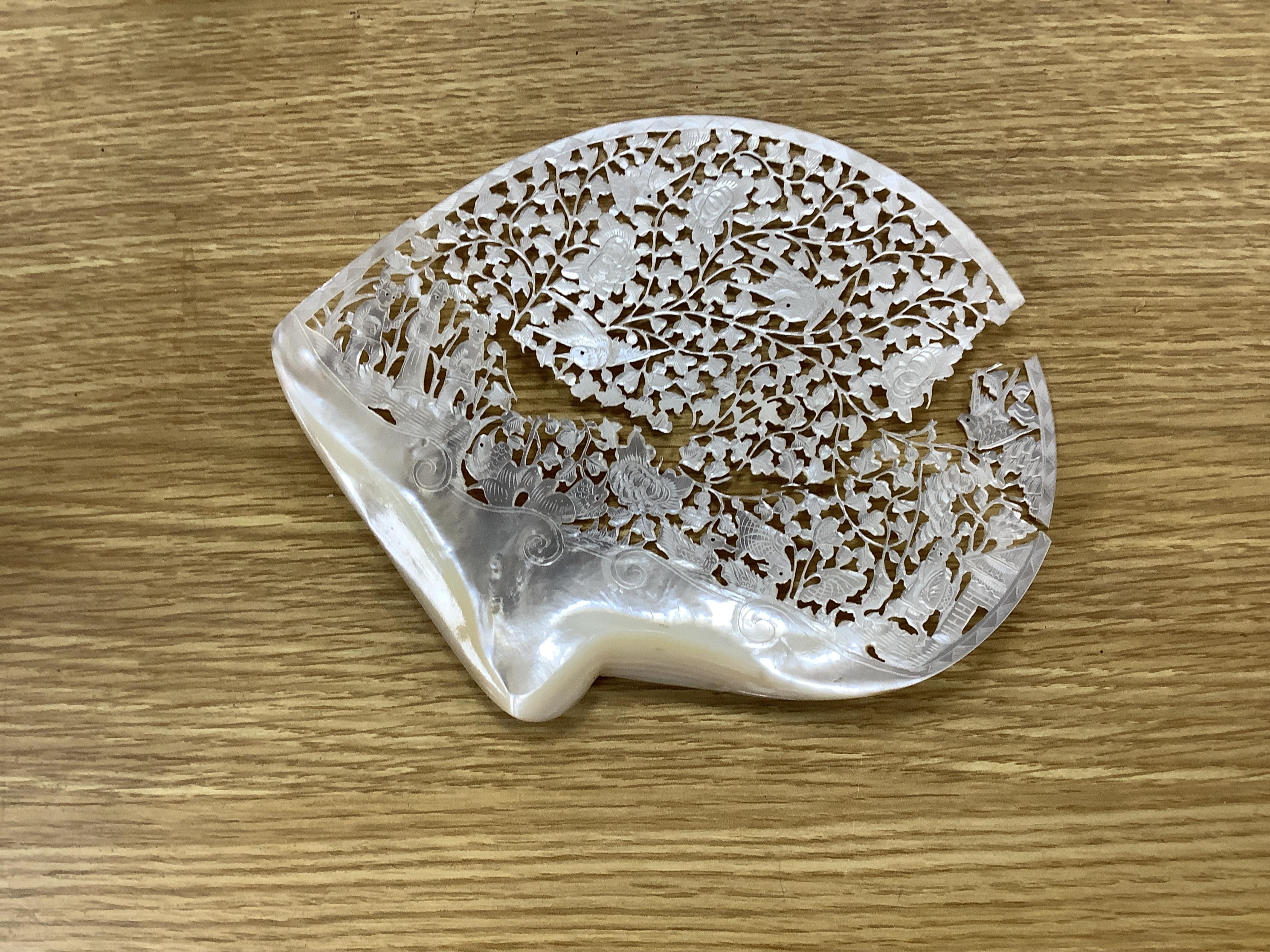 An early 20th century Chinese crackleglaze vase and a pair of mother of pearl carvings and stands. Condition - one carving in two pieces